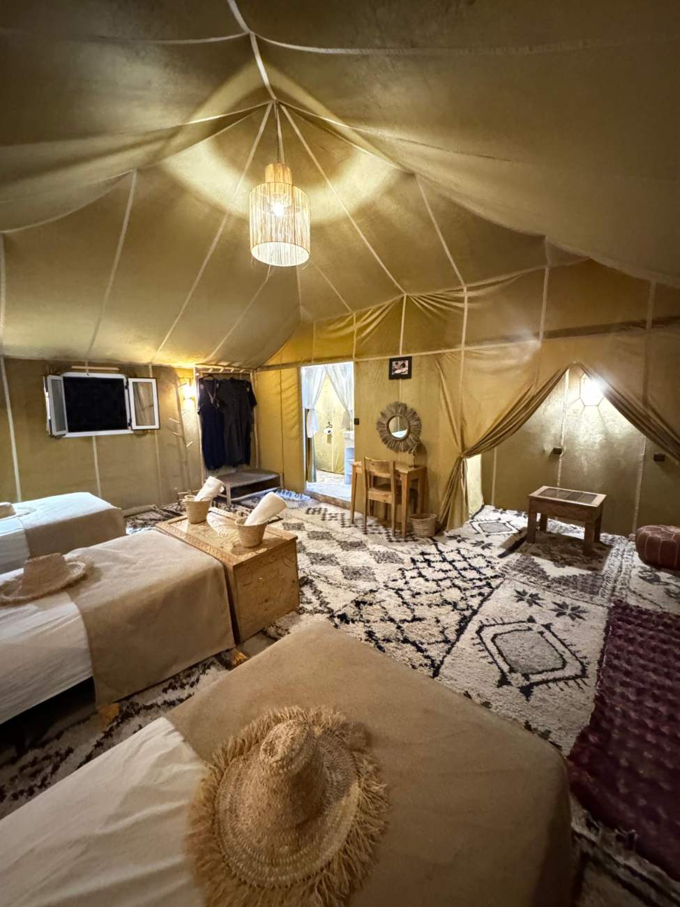 Inside the tent: a bed and rugs