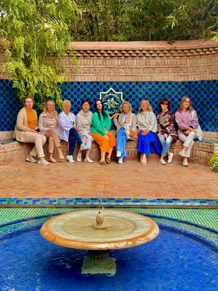 A group of women on a bench in the Majorelle Garden